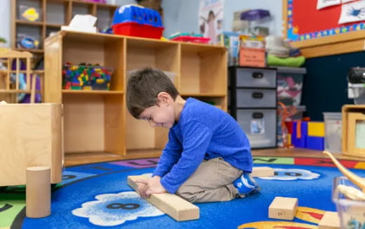 a child coloring on a paper