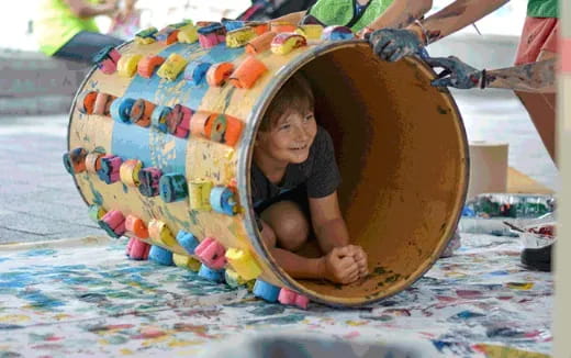 a child in a large plastic slide