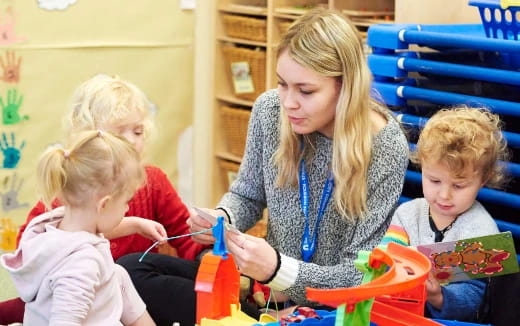 a person and children playing with toys