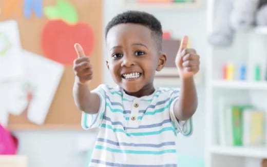 a young boy smiling