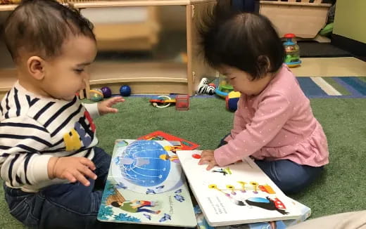 a couple of children playing with toys