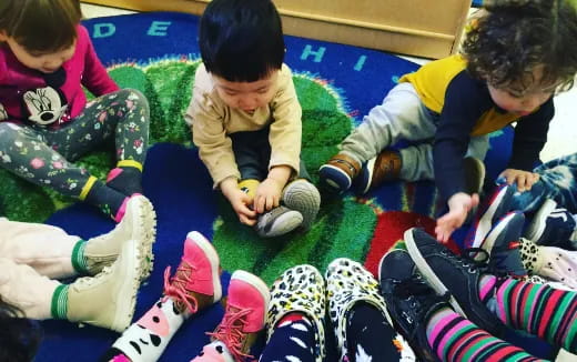 a group of children playing with a toy