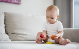 a baby playing with toys
