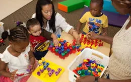 a group of children playing with toys