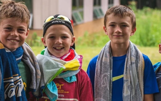 a group of boys smiling