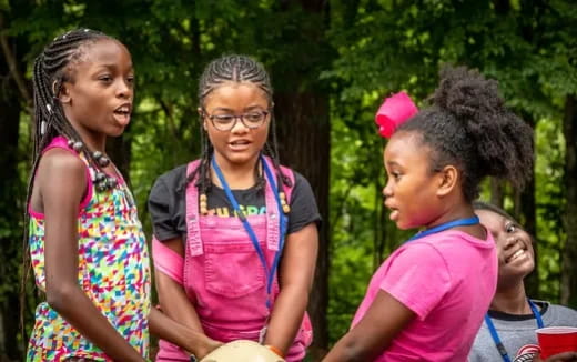 a group of women standing outside