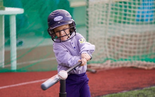 a young boy playing baseball