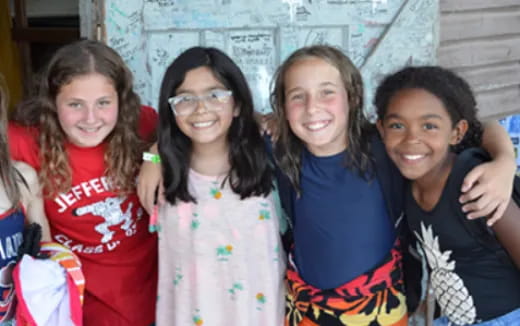 a group of girls posing for a photo