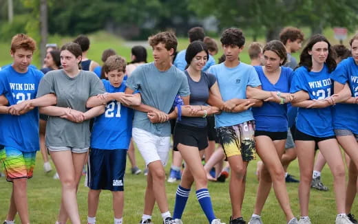 a group of people in sports uniforms