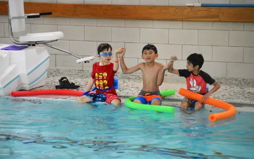 a group of kids in a pool