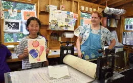 a person and a child in a classroom
