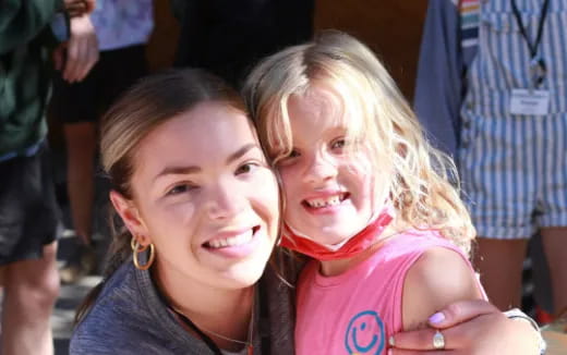 a person and a girl smiling