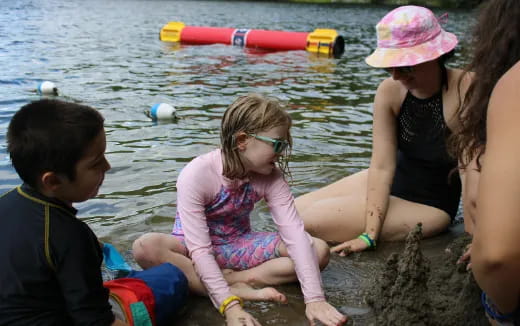a group of children playing in the water