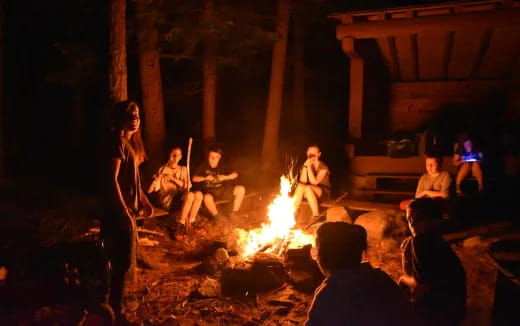a group of people around a fire
