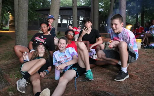 a group of people sitting together outside