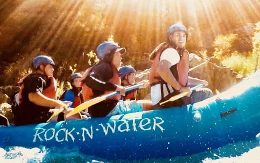 a group of people in a raft