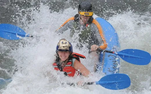 a man and a woman kayaking