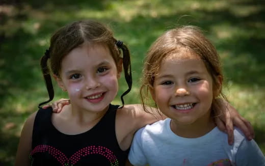 a couple of girls smiling