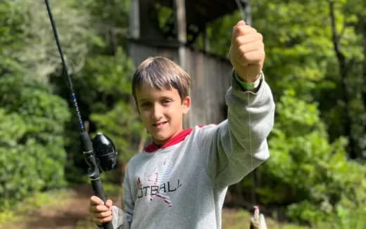 a boy holding a golf club