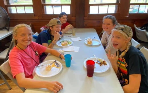 a group of people eating at a table