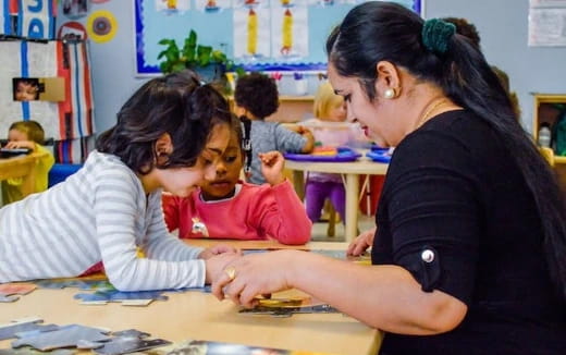 a teacher helping a student