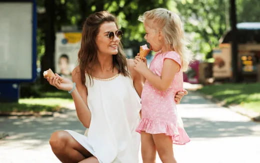 a woman holding a girl