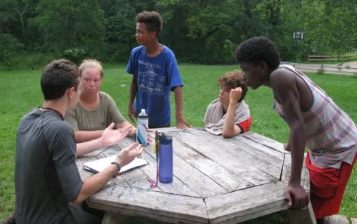a group of people playing a board game