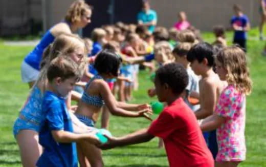 a group of children playing with a ball