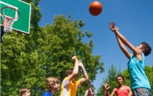 a person shooting a basketball