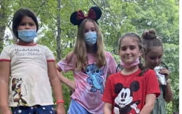 a group of children wearing face masks