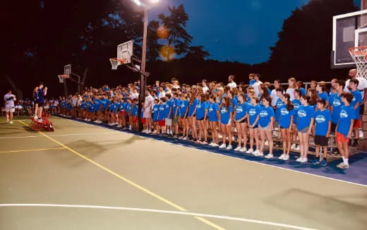 a group of people posing for a photo on a track