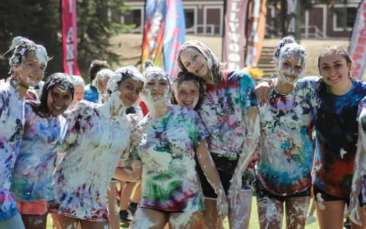 a group of women in colorful dresses