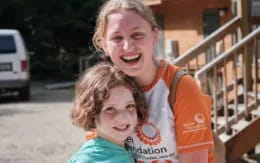 a person and a girl smiling