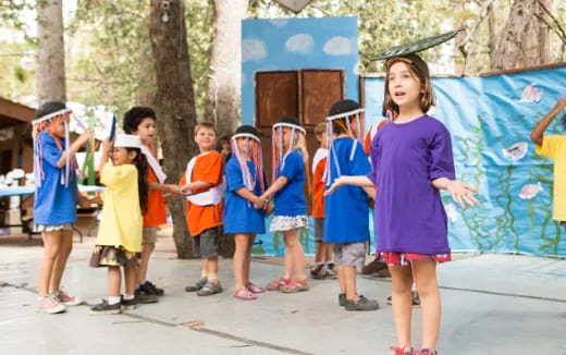 a group of children standing outside