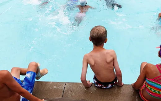 a group of people in a pool