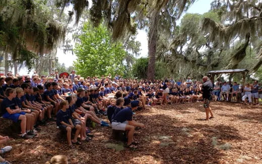 a group of people sitting in a circle in a circle