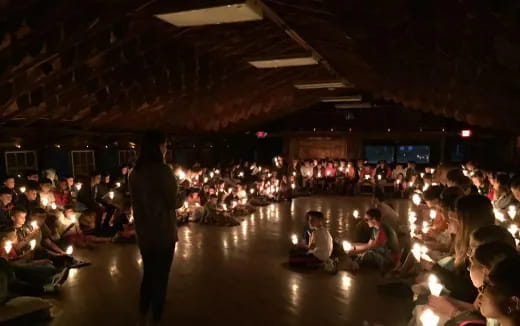 a person standing in front of a large crowd of people