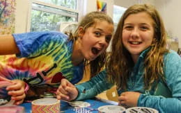 a couple of girls smiling