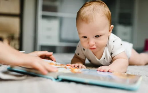 a baby looking at a tablet