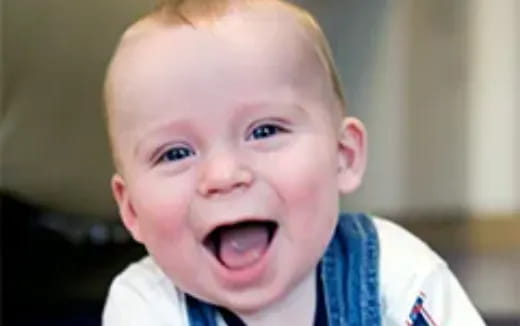 a baby with a surprised expression