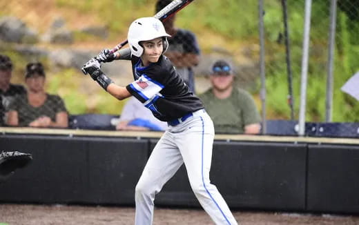 a baseball player swinging a bat