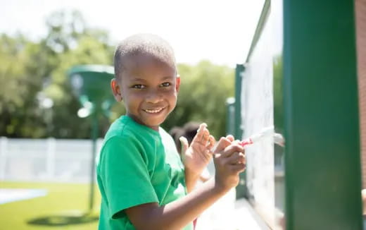 a boy holding a toothbrush