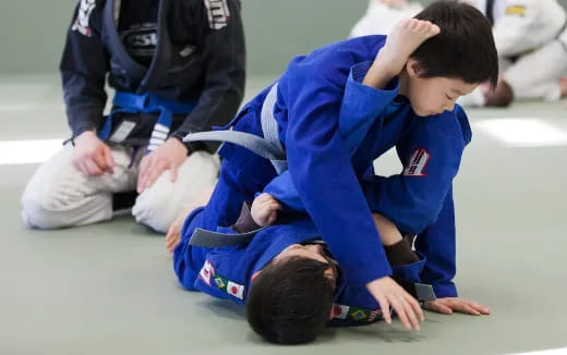 a boy in a blue shirt