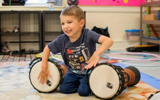 a boy playing drums