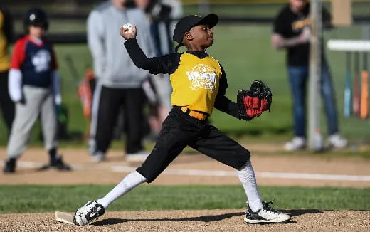 a boy throwing a baseball