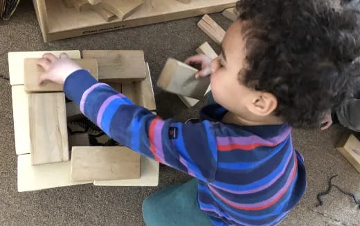 a child sitting at a desk