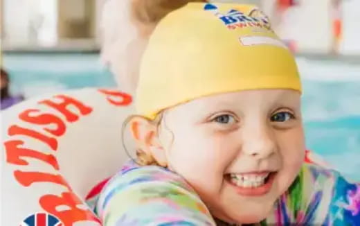 a child wearing a yellow hat