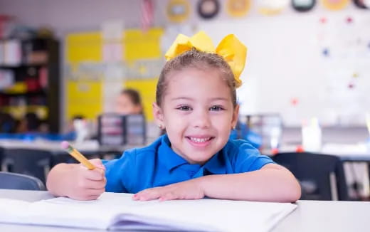a child with a yellow flower crown