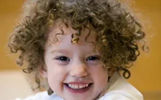 a child with curly hair