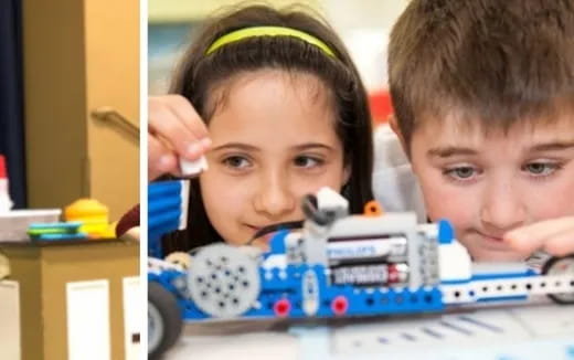 a couple of kids looking at a toy car